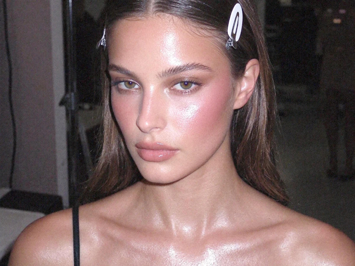 Dewy makeup and slicked-back hair beauty portrait