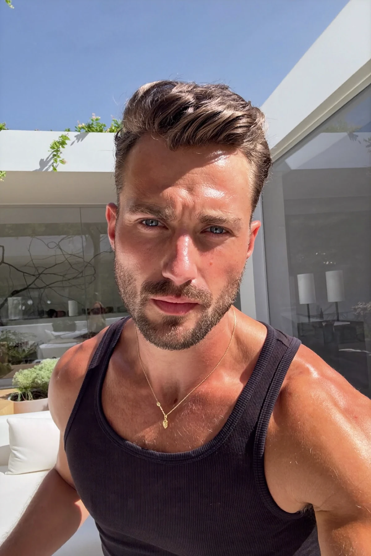 Casual male lifestyle portrait on a sunny terrace